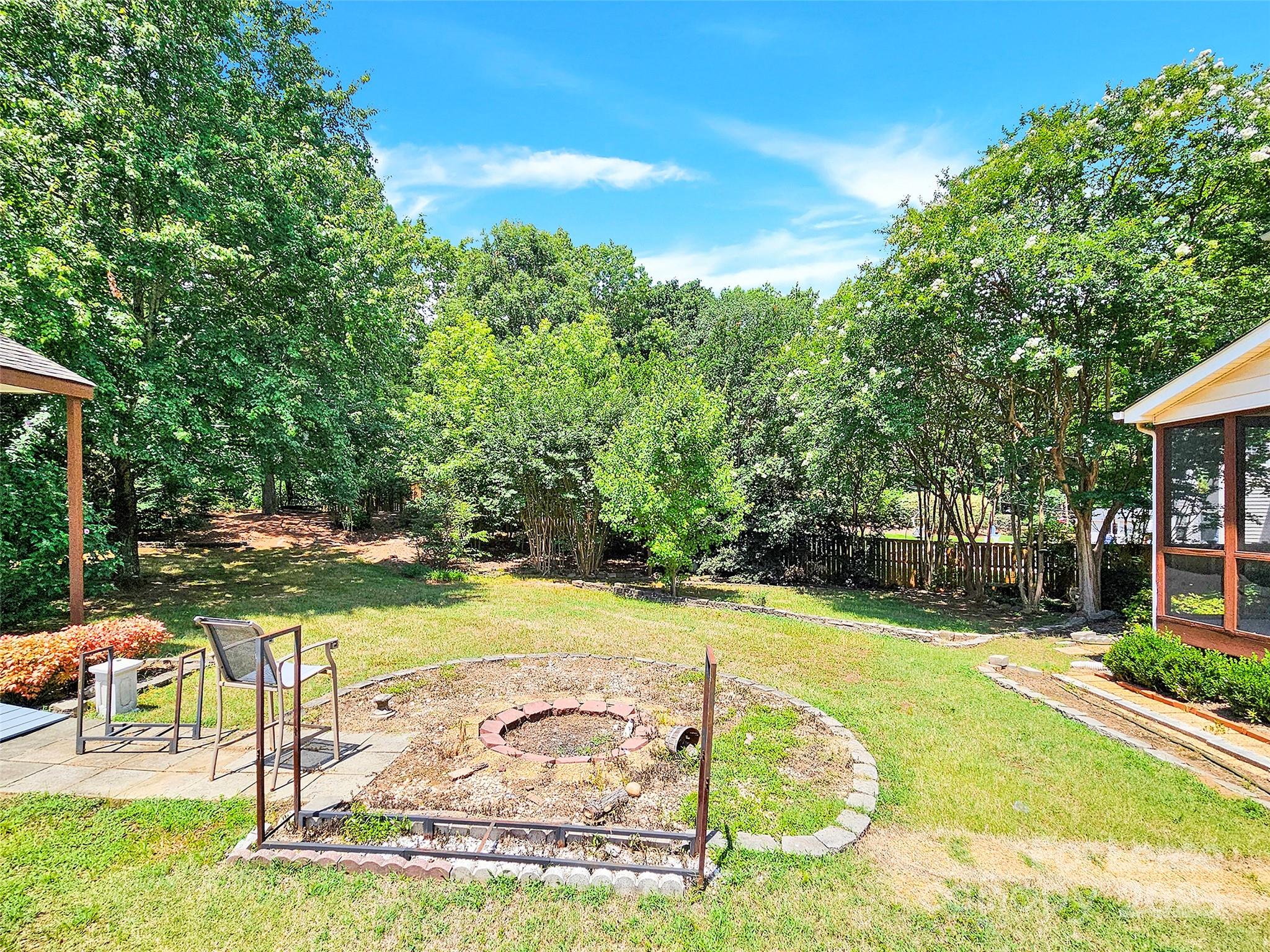 8534 Headford Road Charlotte, NC 28277 - Photo 7 of 48 a view of a swimming pool with an outdoor space and seating area