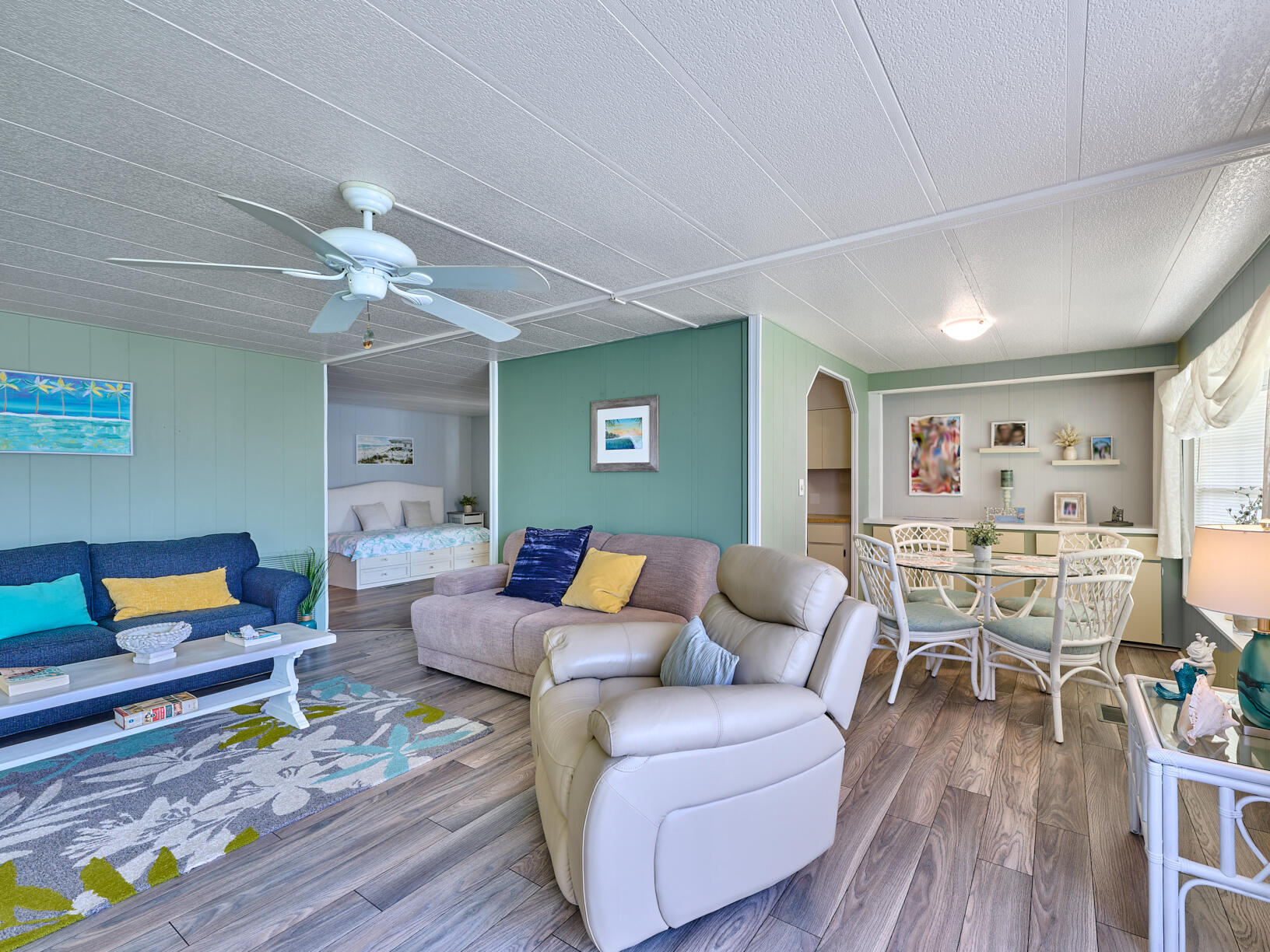 6977 Southeast Delegate Street Hobe Sound, FL 33455 - Photo 22 of 60 a living room with furniture and wooden floor