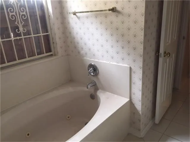 a view of wooden floor and windows in a room