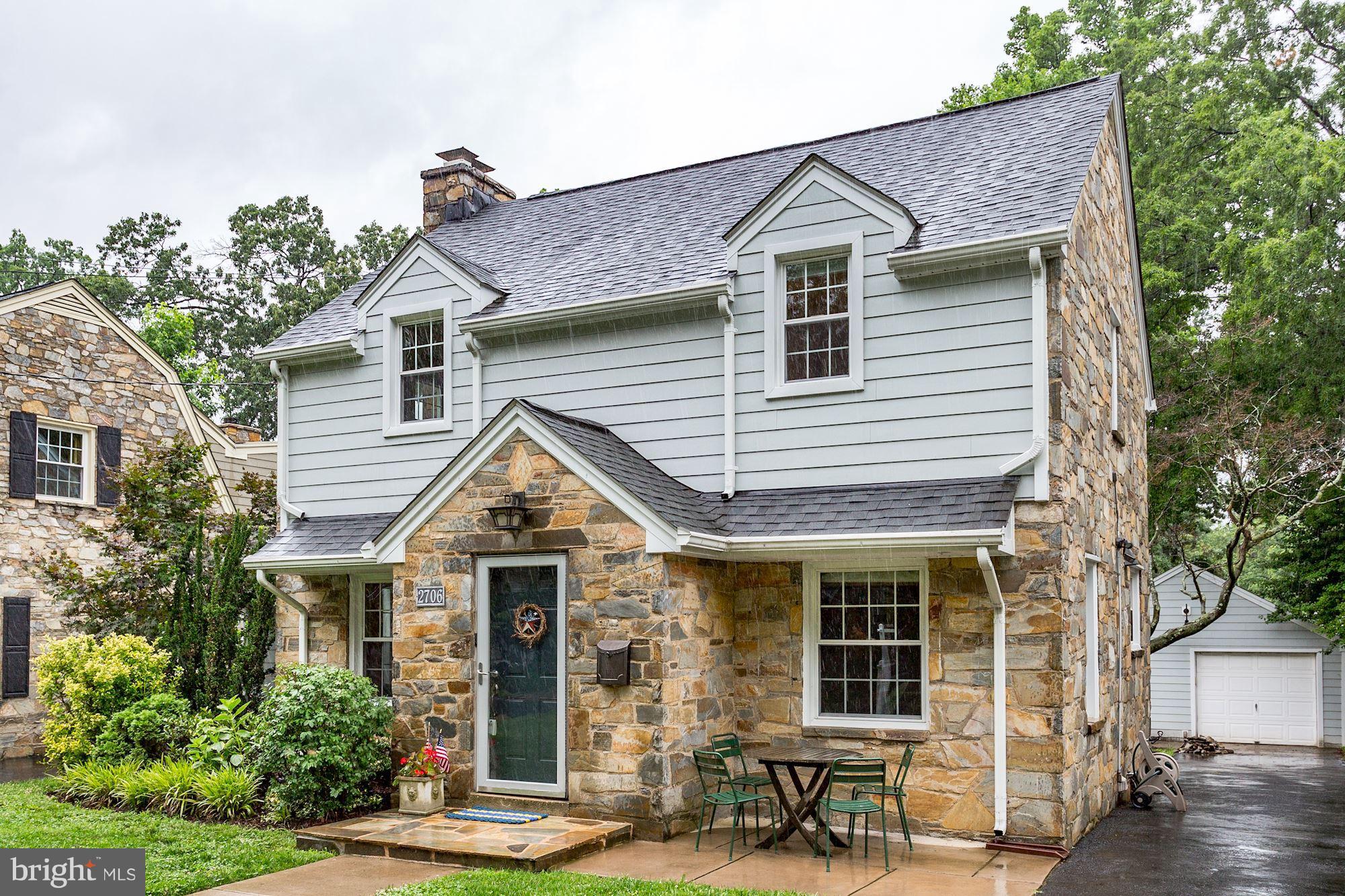 2706 Ridge Rd Drive Alexandria, VA 22302 - Photo 2 of 30 a view of a white house with large windows and a large tree