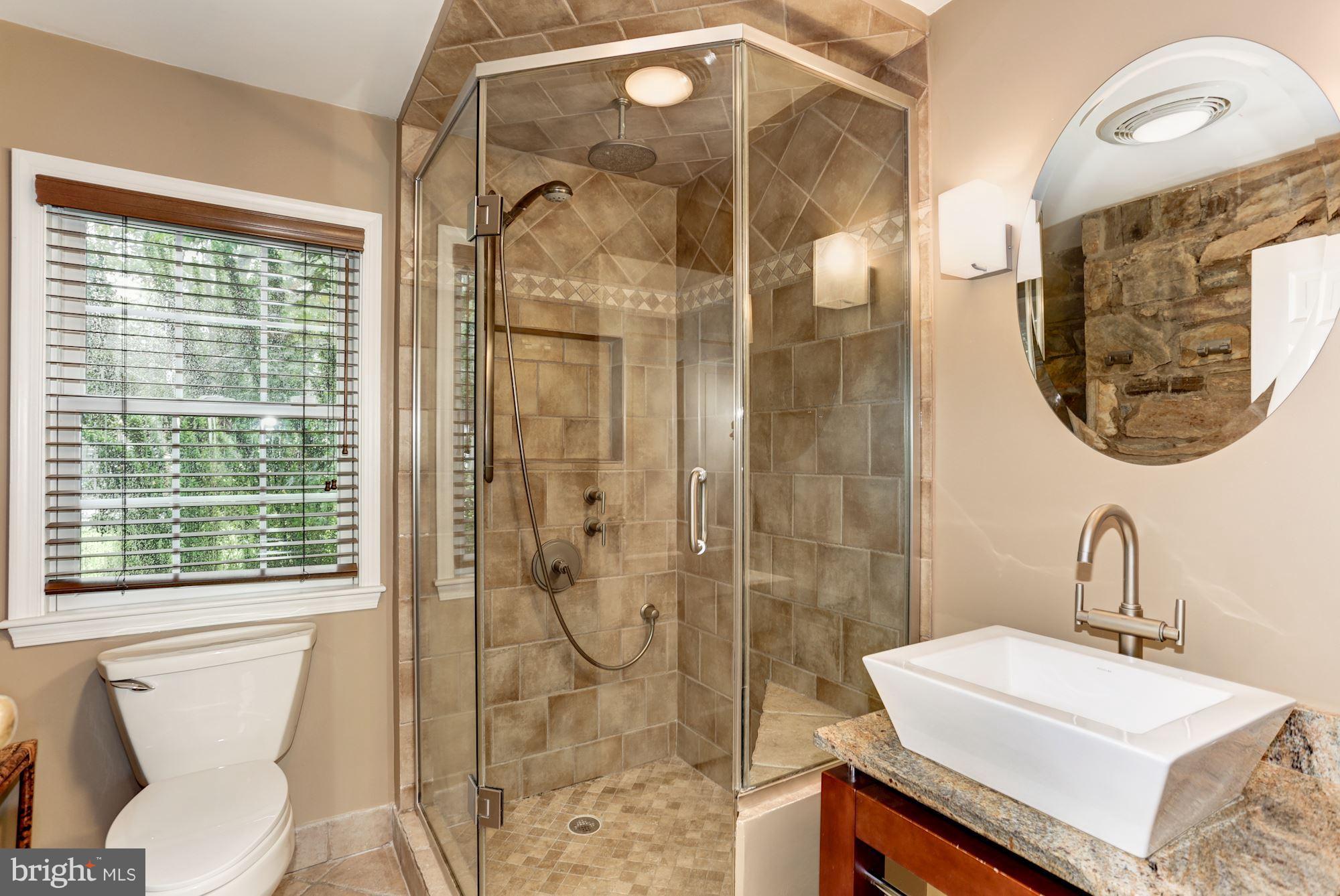 2706 Ridge Rd Drive Alexandria, VA 22302 - Photo 14 of 30 a bathroom with a sink and a mirror