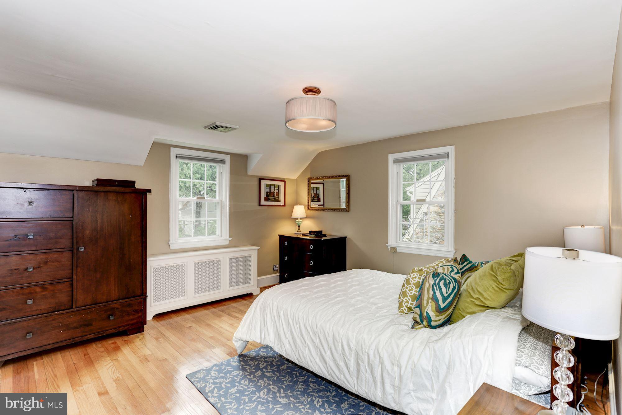 2706 Ridge Rd Drive Alexandria, VA 22302 - Photo 17 of 30 a bedroom with a bed dresser and a window