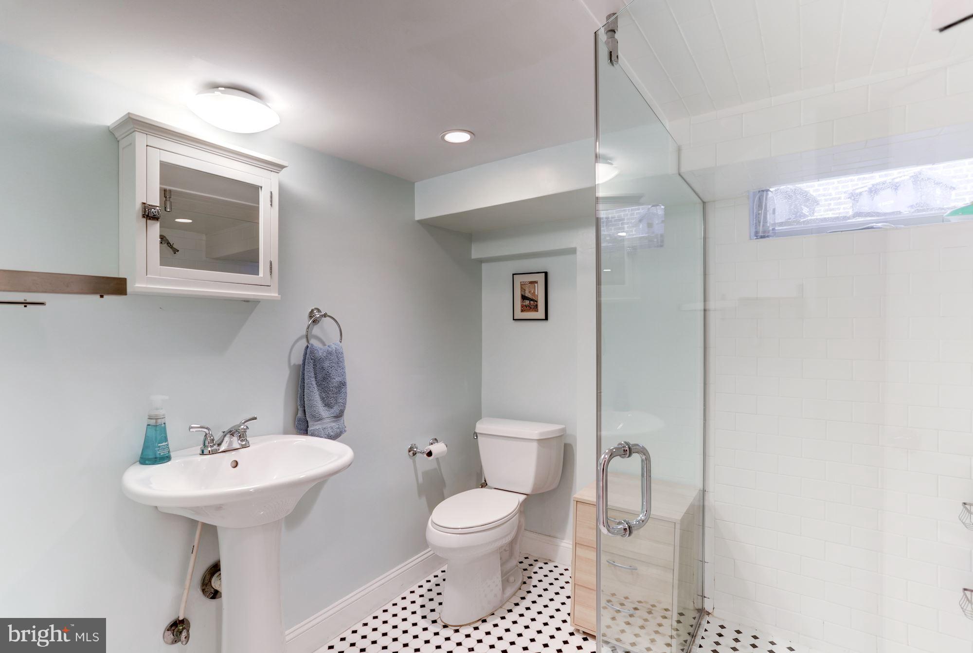 2706 Ridge Rd Drive Alexandria, VA 22302 - Photo 26 of 30 a bathroom with a toilet sink and mirror