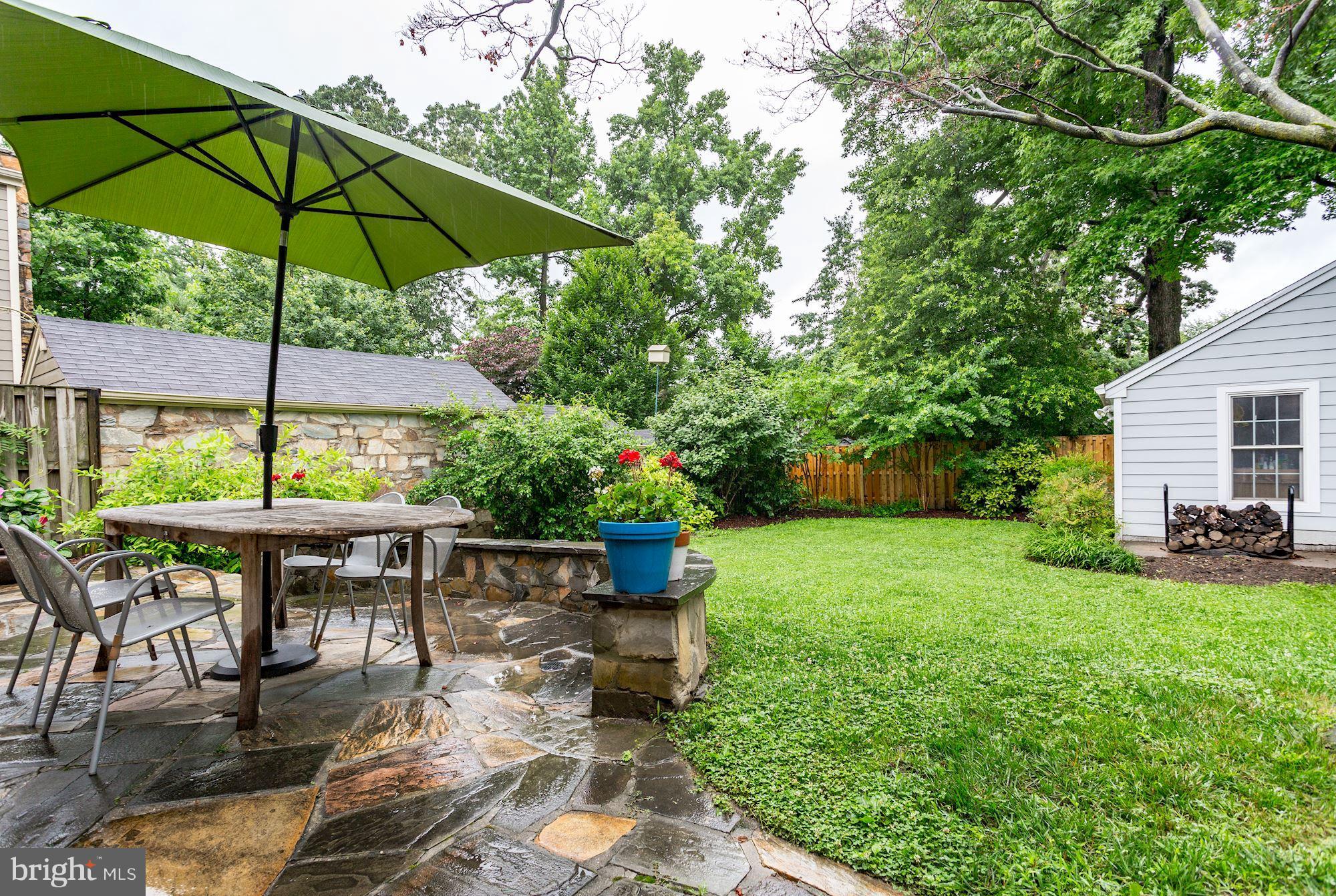 2706 Ridge Rd Drive Alexandria, VA 22302 - Photo 28 of 30 a view of table and chairs under an umbrella