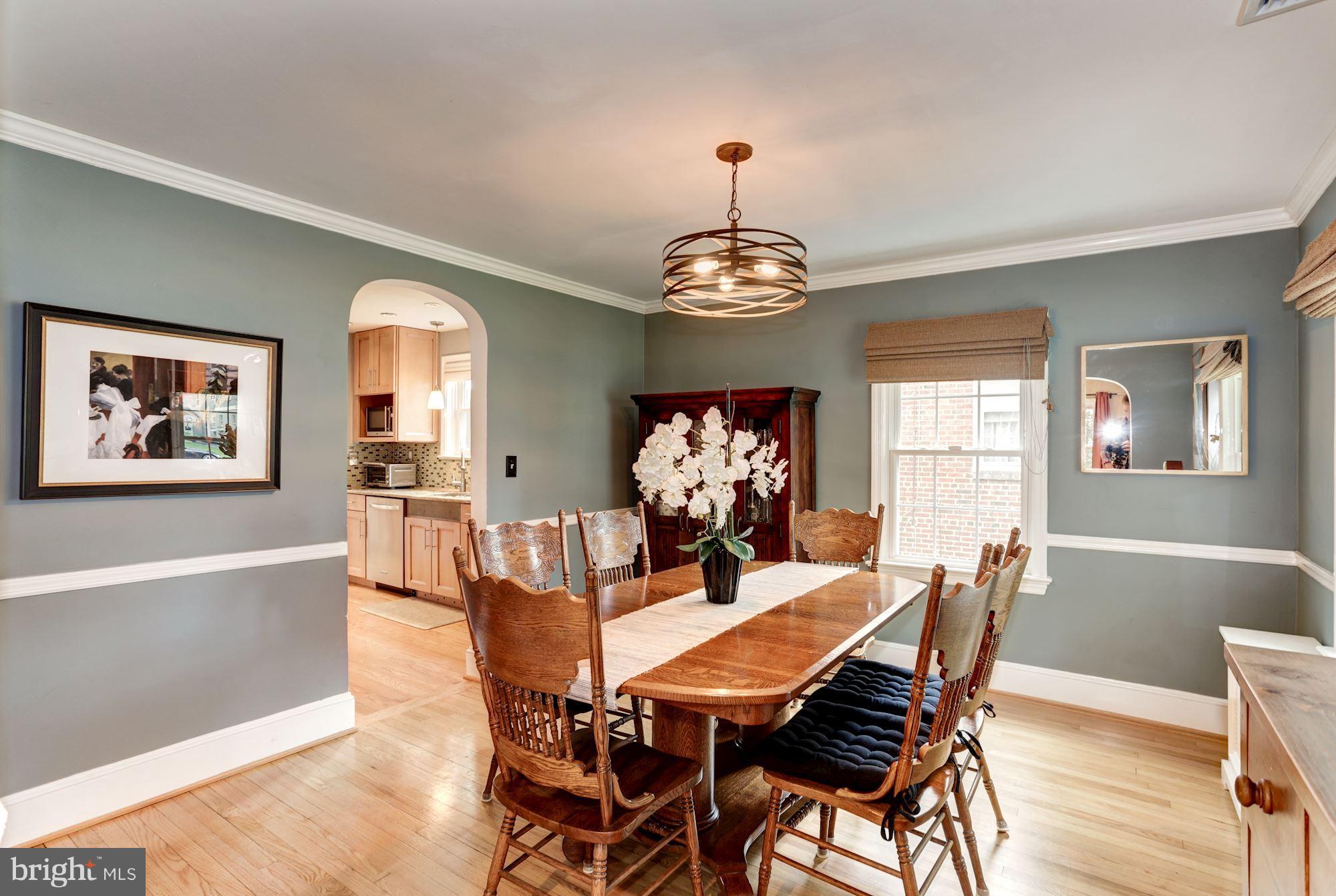 2706 Ridge Rd Drive Alexandria, VA 22302 - Photo 6 of 30 a view of a dining room with furniture a chandelier and wooden floor