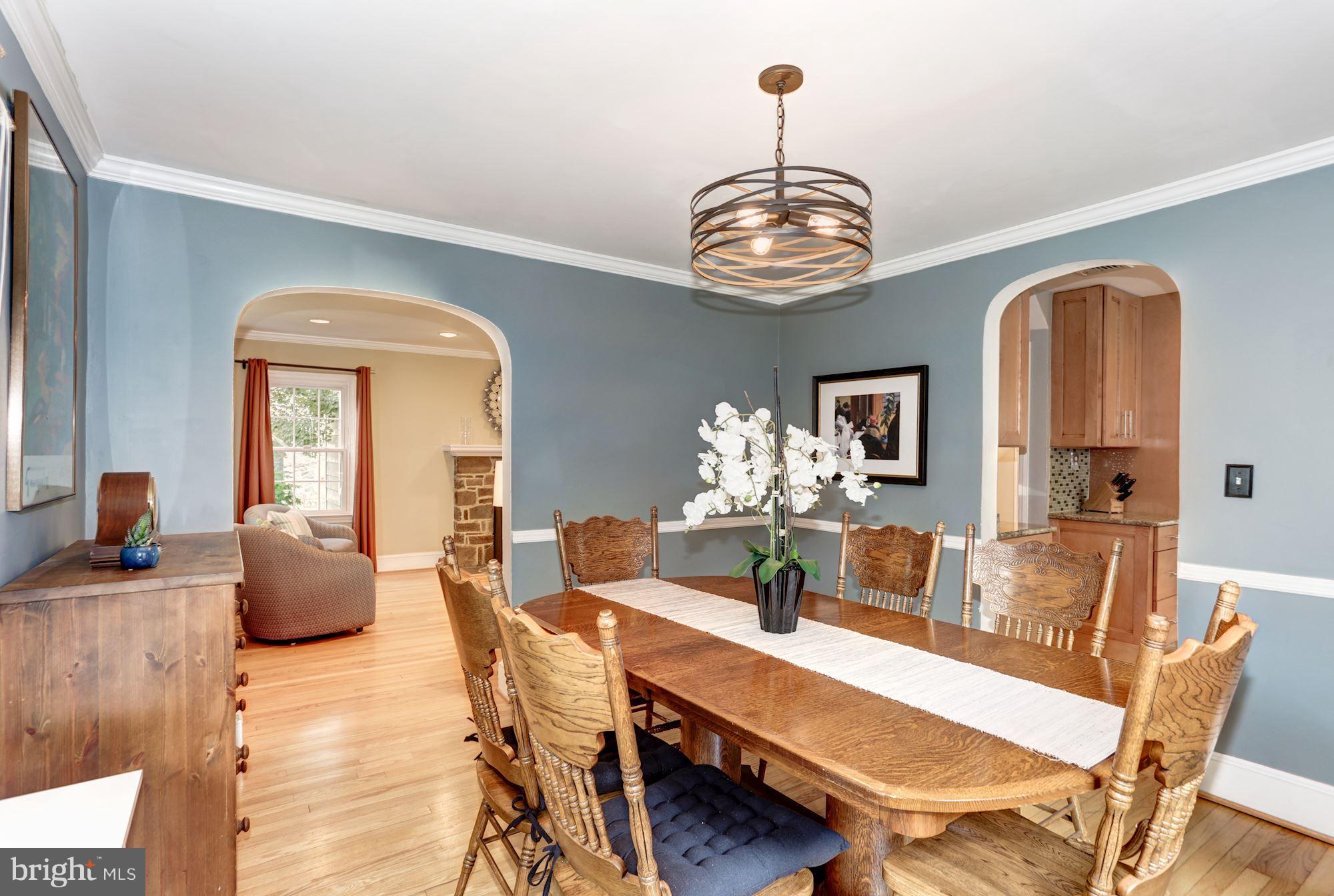 2706 Ridge Rd Drive Alexandria, VA 22302 - Photo 8 of 30 a view of a dining room with furniture a chandelier and wooden floor