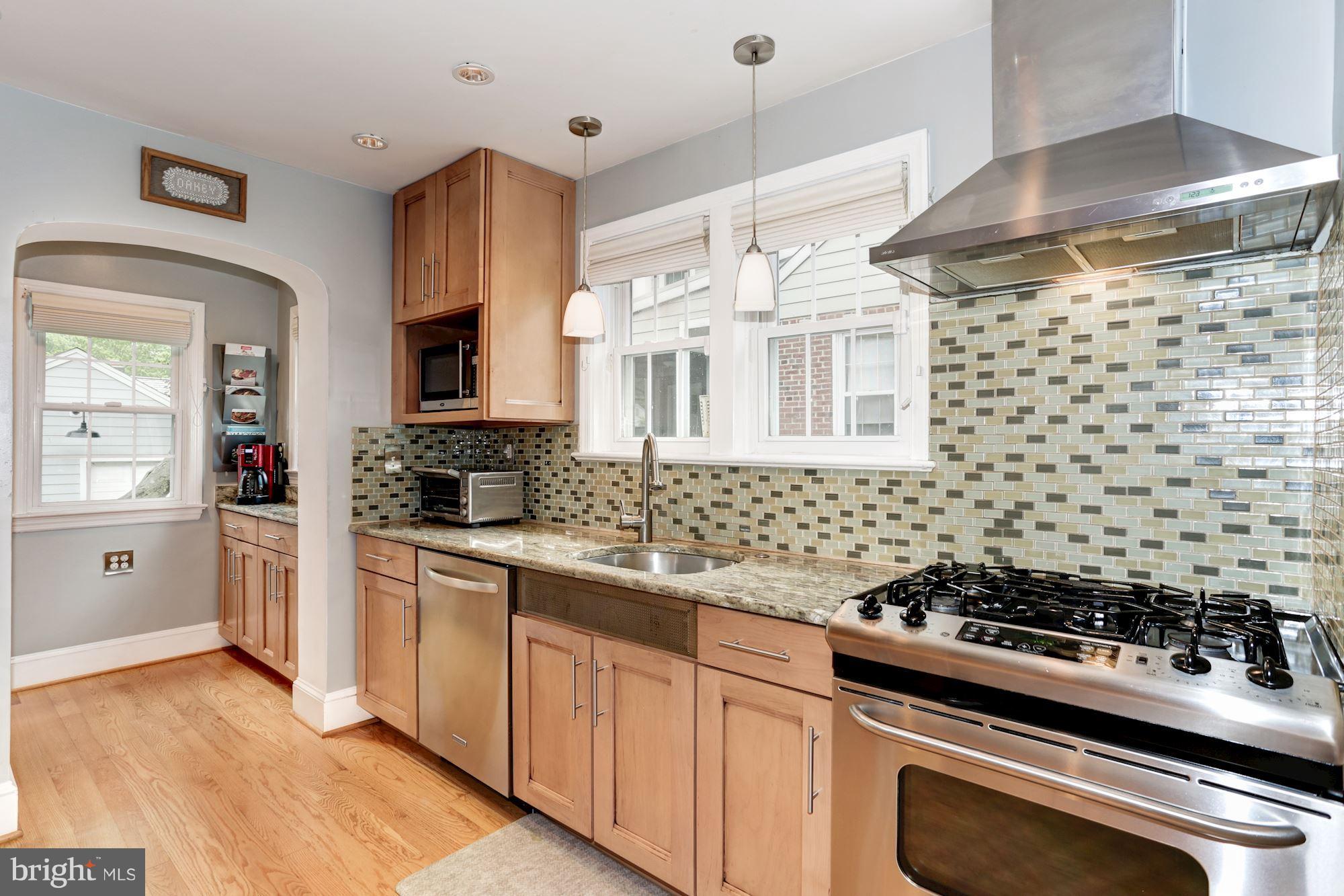 2706 Ridge Rd Drive Alexandria, VA 22302 - Photo 9 of 30 a kitchen with a stove a sink and a refrigerator