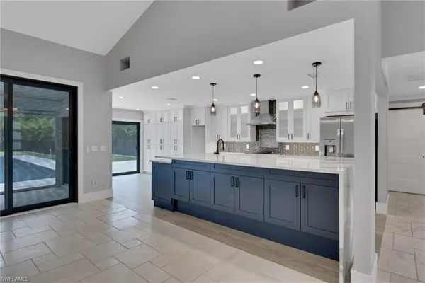 a large bathroom with a large mirror vanity and shower