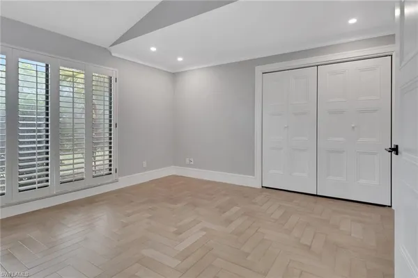 a view of an empty room with a window