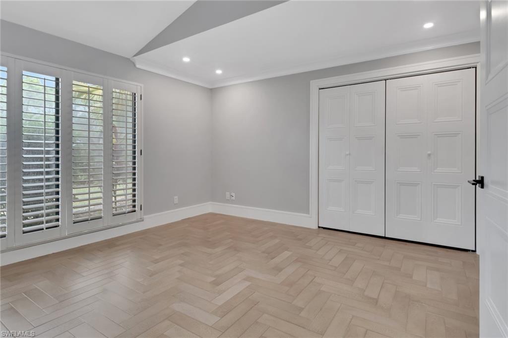 1806 Princess Court Naples, FL 34110 - Photo 19 of 40 a view of an empty room with a window