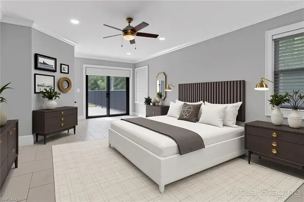 a spacious bedroom with a large bed and a chandelier