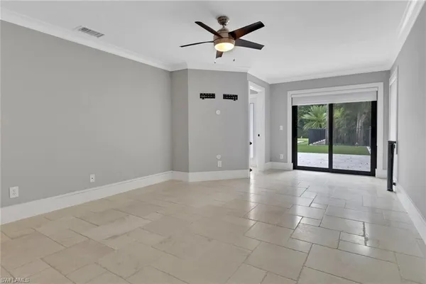 a view of an empty room with a window
