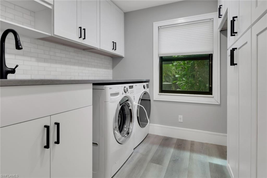 1806 Princess Court Naples, FL 34110 - Photo 32 of 40 a utility room with dryer and washer