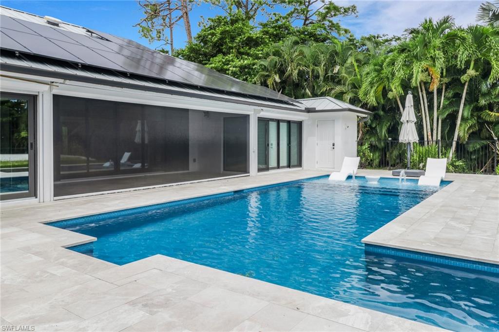 1806 Princess Court Naples, FL 34110 - Photo 36 of 40 a view of backyard with hardwood floor and large tree