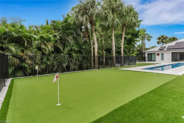 a view of a house with a backyard