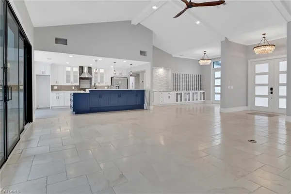 a kitchen with stainless steel appliances a refrigerator and a sink