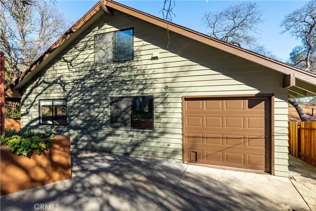 a front view of a house with garage