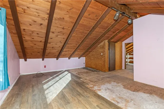 a view of a room with wooden walls