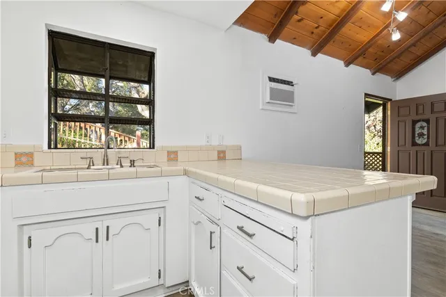 a kitchen with a sink and a window