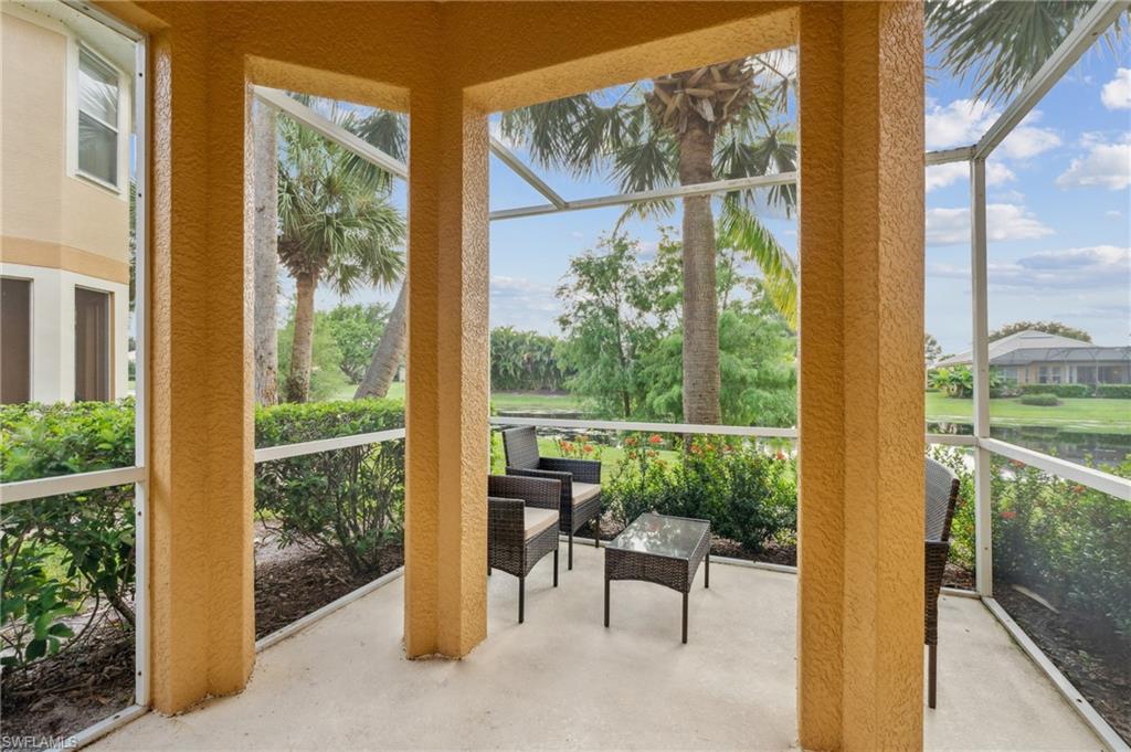 20048 Heatherstone Way, Unit 1 Estero, FL 33928 - Photo 20 of 20 a view of a room with a large window and dining table