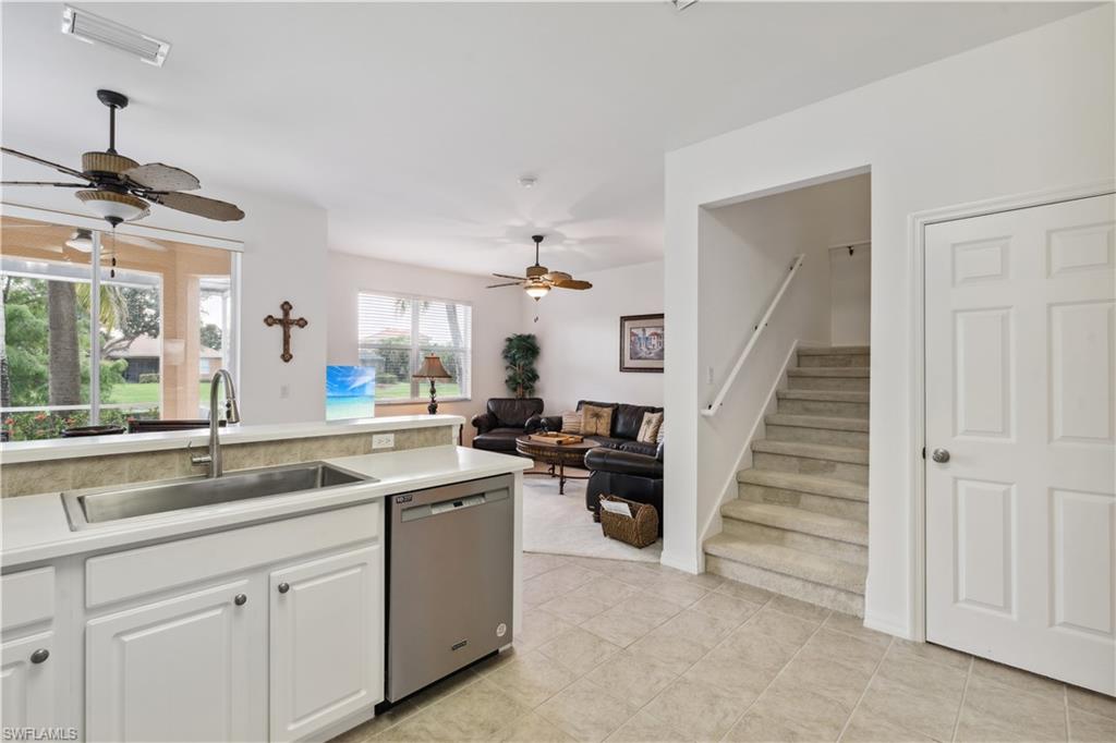 20048 Heatherstone Way, Unit 1 Estero, FL 33928 - Photo 4 of 20 a kitchen with cabinets and sink