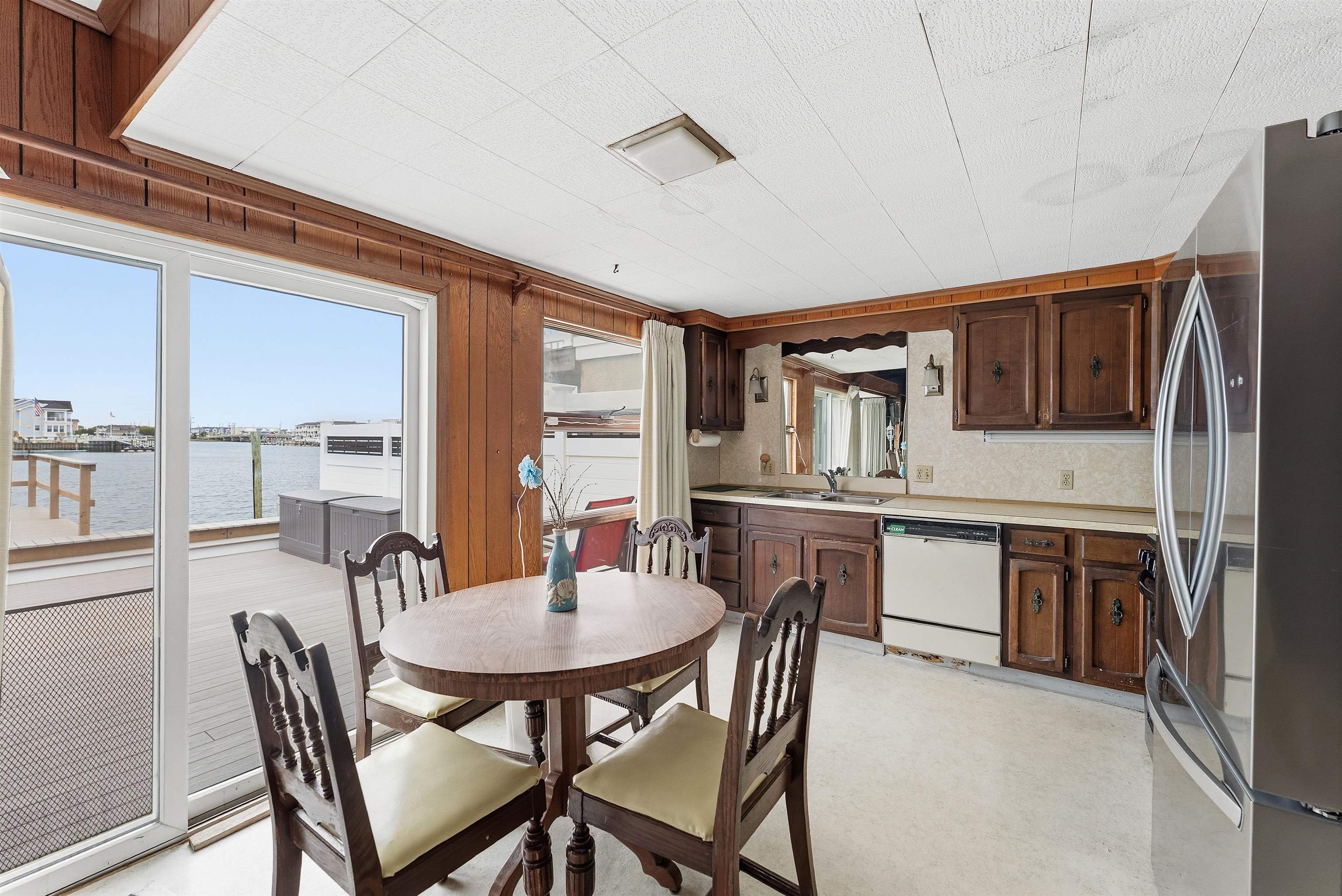 9727 3rd, Unit A1 Stone Harbor, NJ 08247 - Photo 15 of 20 a dining room with furniture and window