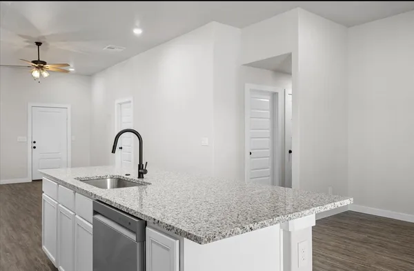 a sink with granite countertop a sink and vanity