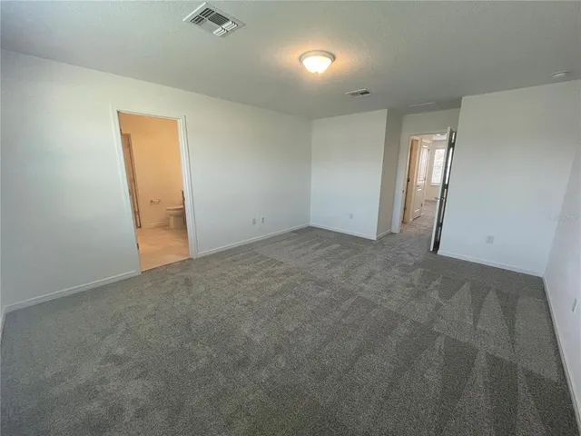 a bathroom with a double vanity sink toilet and shower