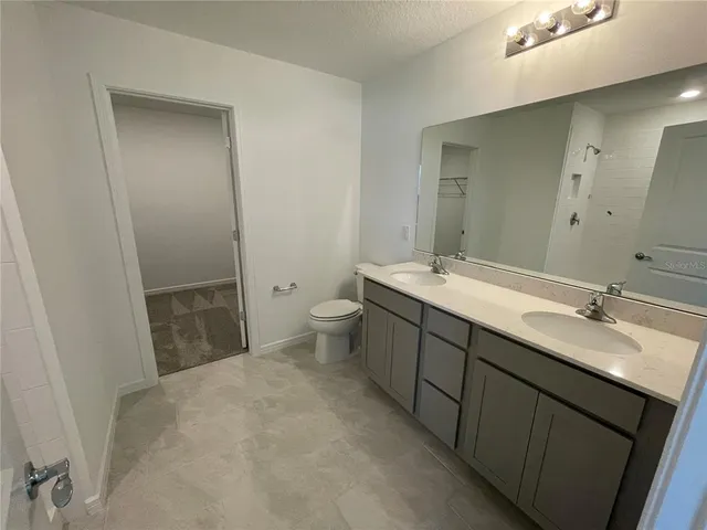 a bathroom with a sink and mirror