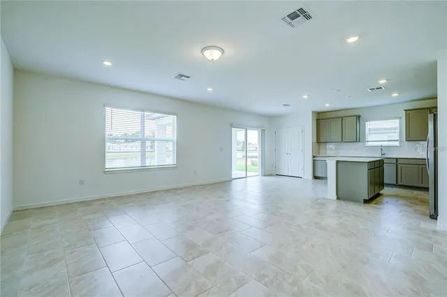a view of a kitchen with a sink and a window