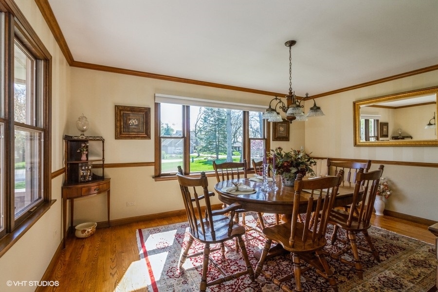 907 Powers Road Woodstock, IL 60098 - Photo 13 of 21 a view of a dining room with furniture window and outside view