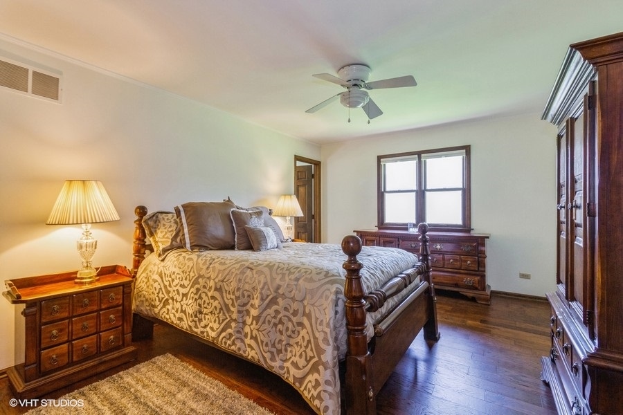 907 Powers Road Woodstock, IL 60098 - Photo 14 of 21 a bedroom with a bed and a window