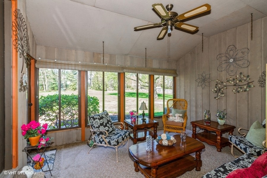907 Powers Road Woodstock, IL 60098 - Photo 20 of 21 a living room with furniture and a large window