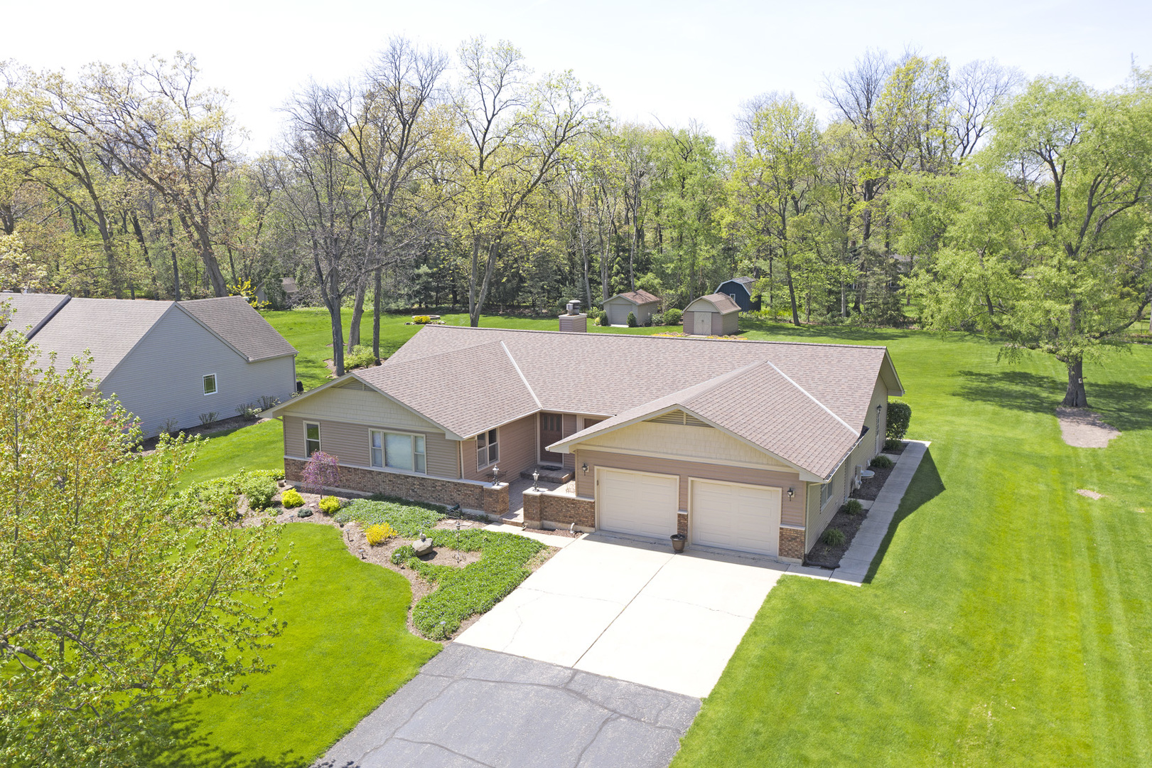 907 Powers Road Woodstock, IL 60098 - Photo 2 of 21 a aerial view of a house with a big yard