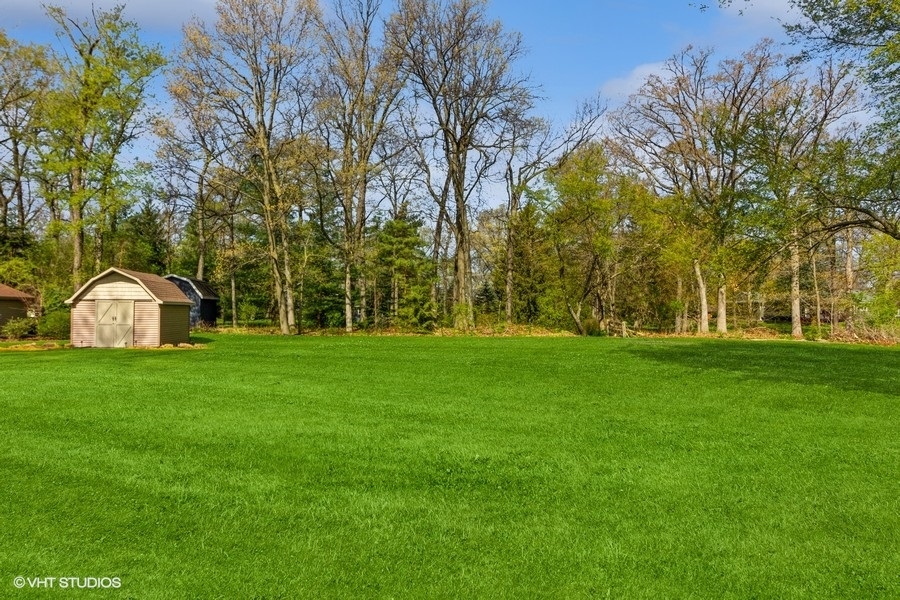 907 Powers Road Woodstock, IL 60098 - Photo 6 of 21 a view of a park with a large trees
