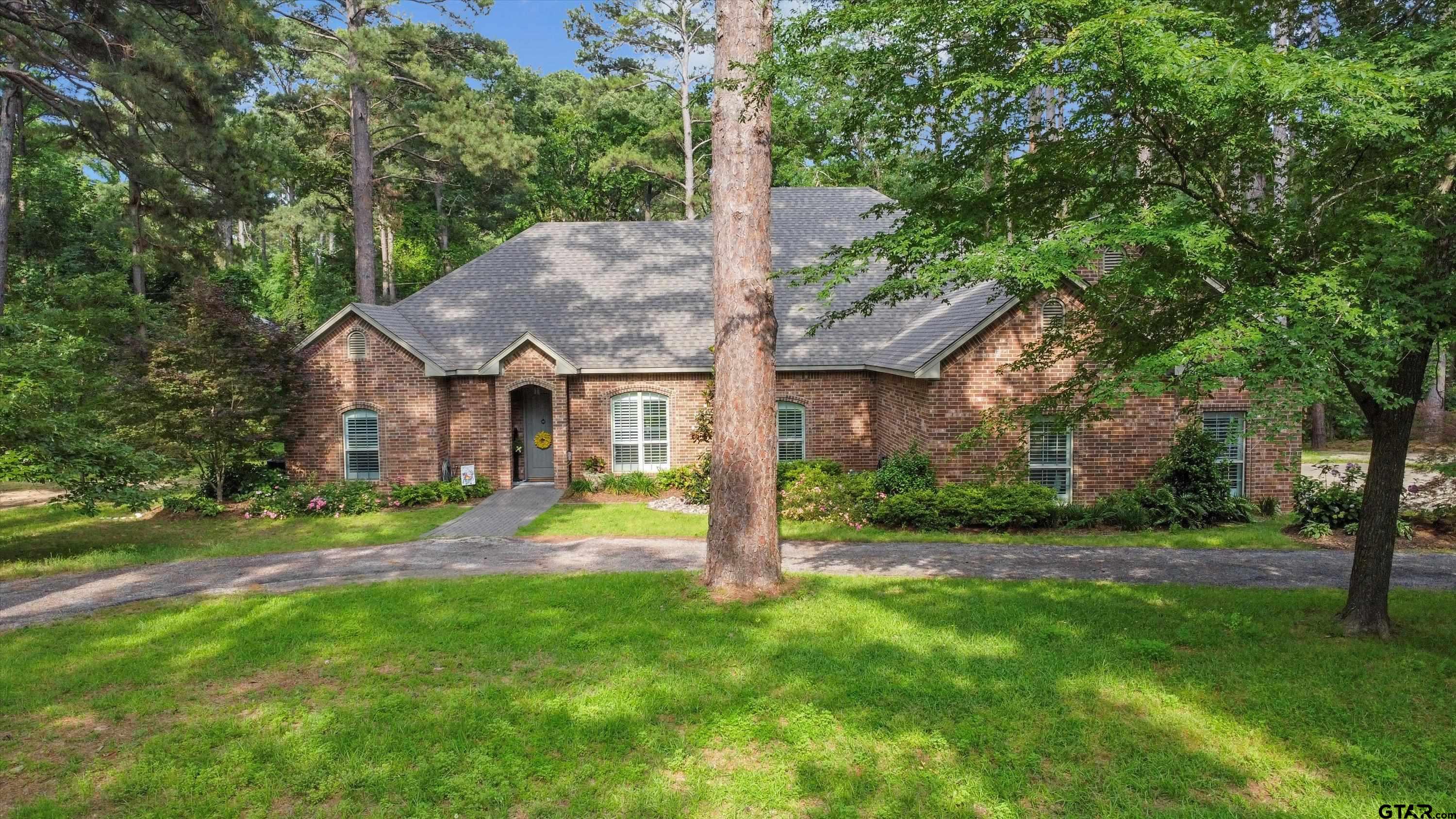 18551 Lazy Lane Flint, TX 75762 - Photo 1 of 45 a view of a house with a yard