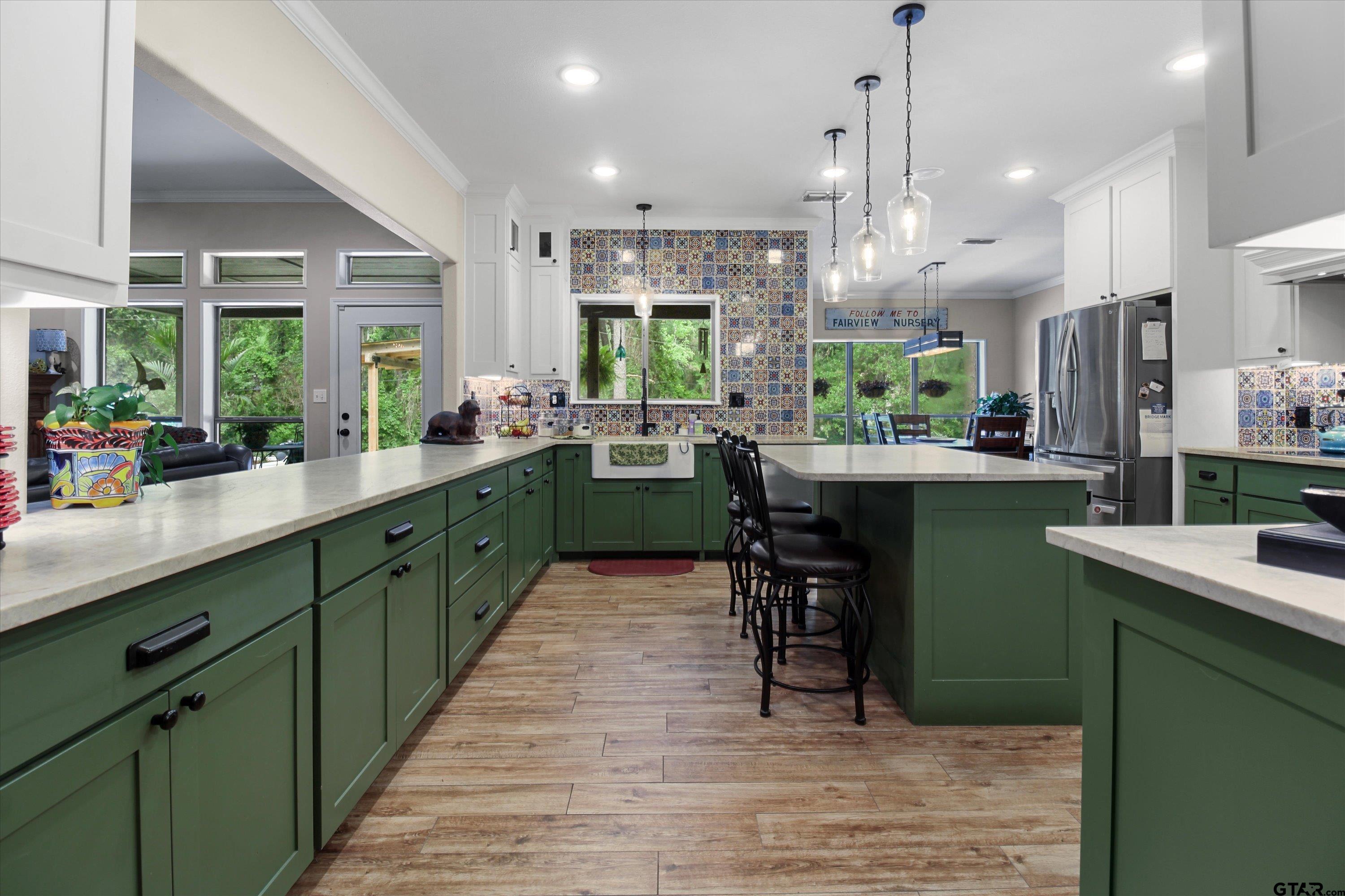 18551 Lazy Lane Flint, TX 75762 - Photo 11 of 45 a kitchen with sink cabinets and wooden floor
