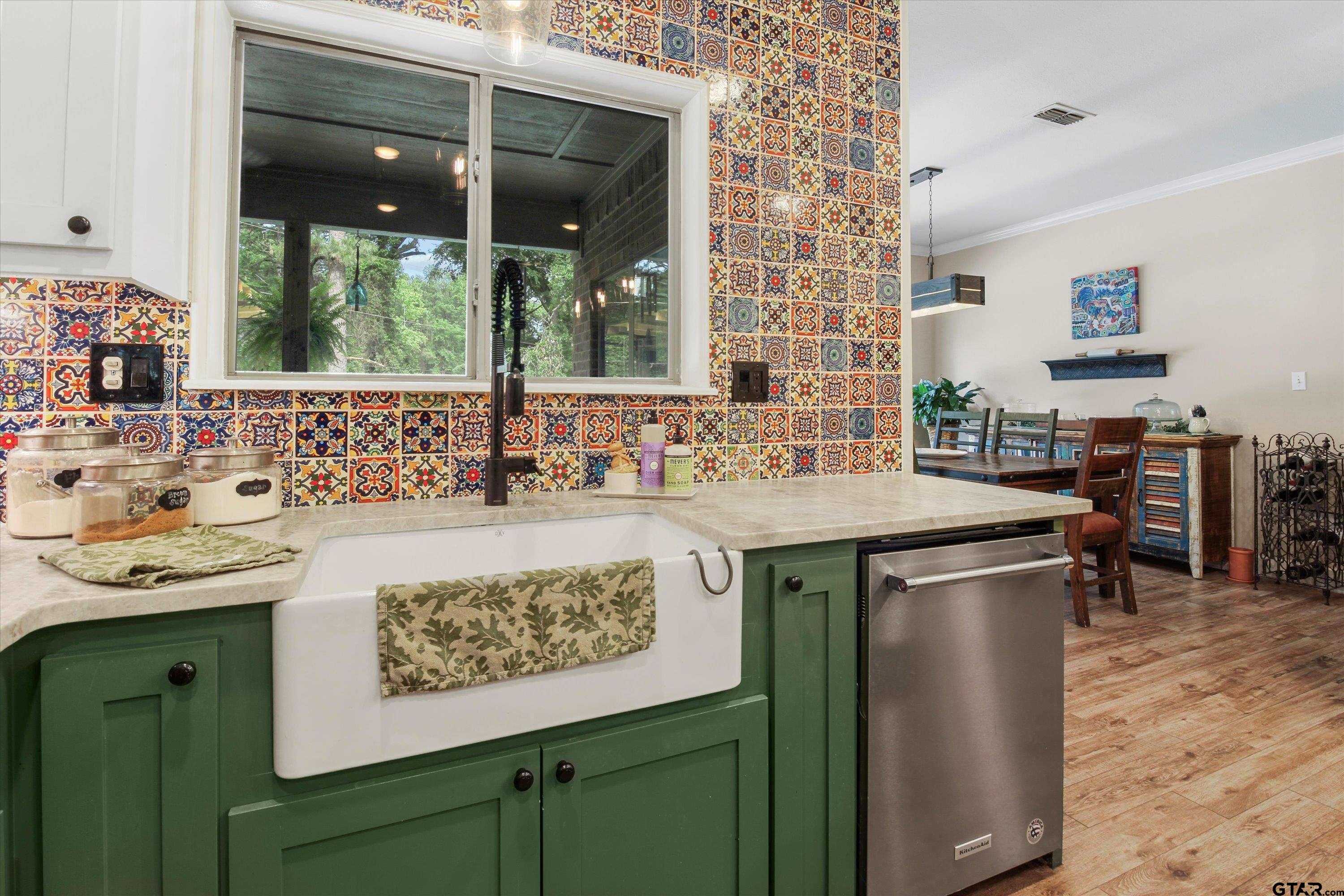 18551 Lazy Lane Flint, TX 75762 - Photo 12 of 45 a kitchen with a sink and a wooden cabinets
