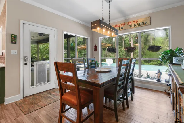 a view of a dining room with furniture window and outside view