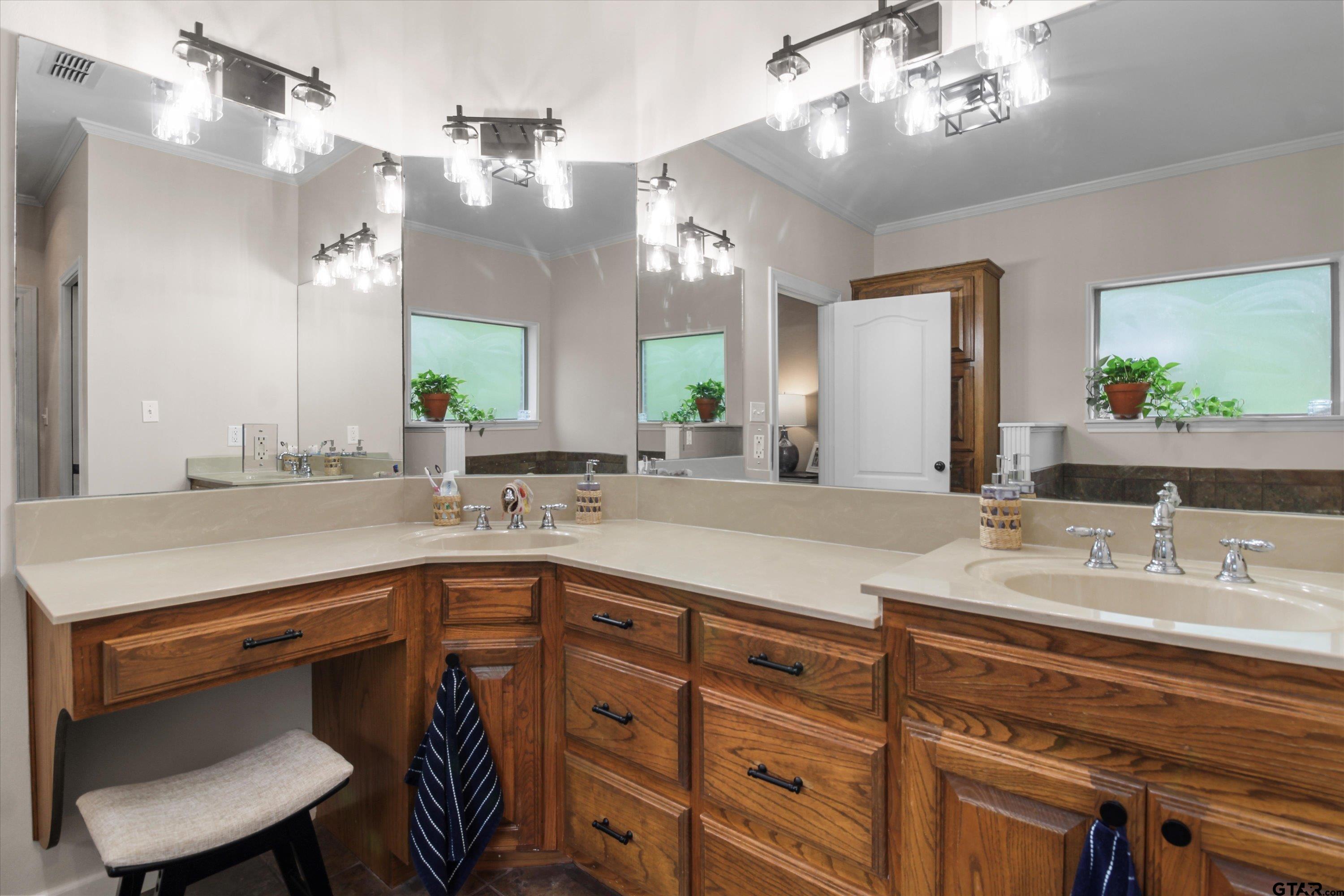 18551 Lazy Lane Flint, TX 75762 - Photo 21 of 45 a spacious bathroom with a sink double vanity and a mirror