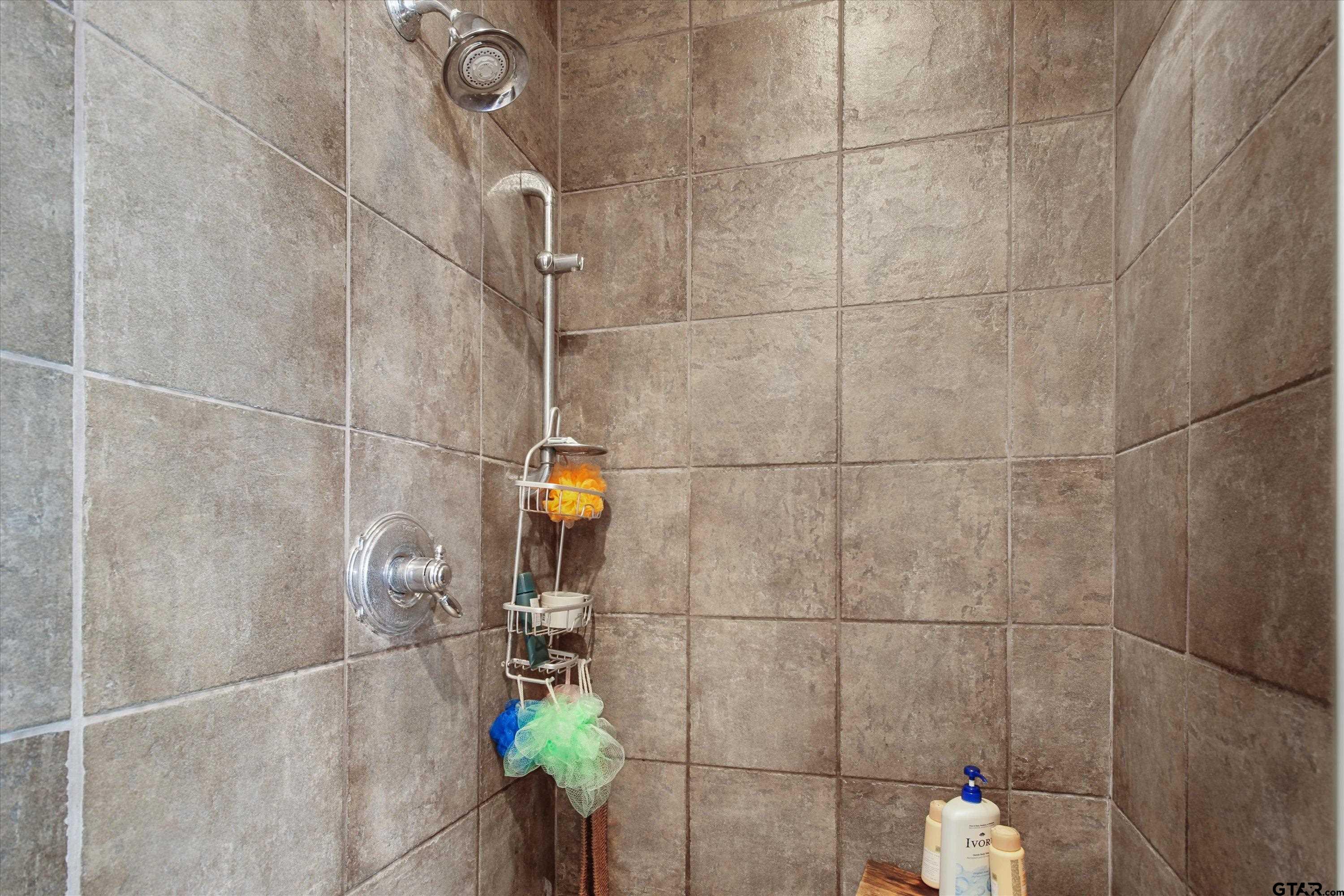 18551 Lazy Lane Flint, TX 75762 - Photo 23 of 45 a bathroom with a shower