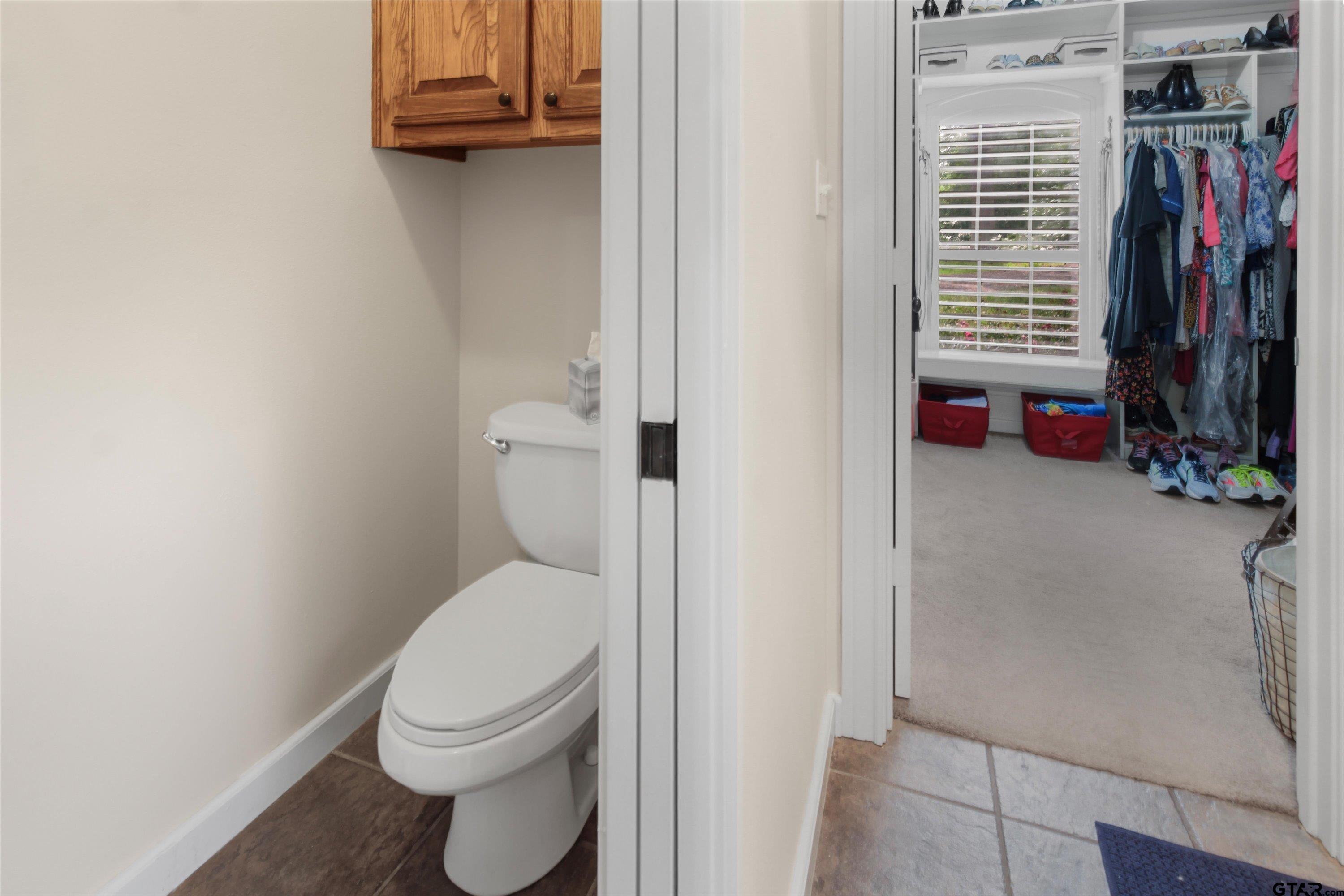 18551 Lazy Lane Flint, TX 75762 - Photo 24 of 45 a bathroom with a toilet and a shower