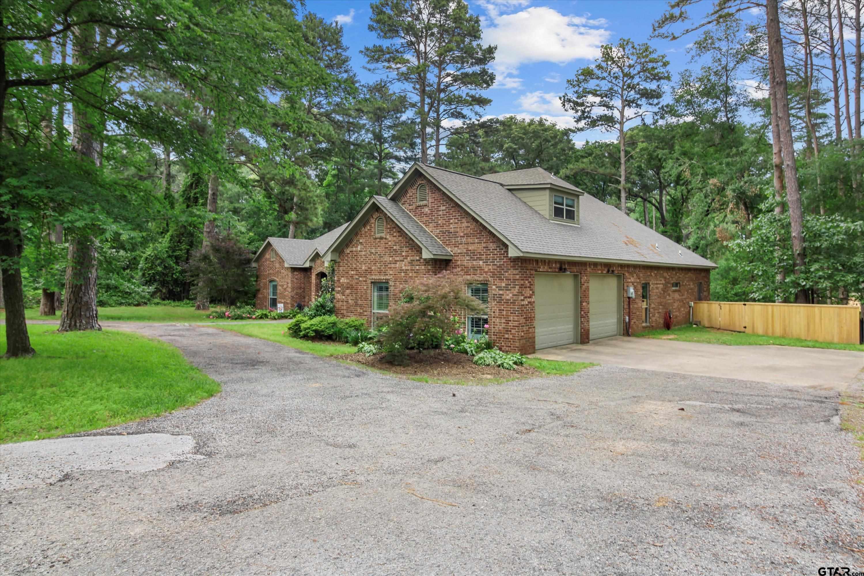 18551 Lazy Lane Flint, TX 75762 - Photo 3 of 45 a view of an house with backyard space and garden