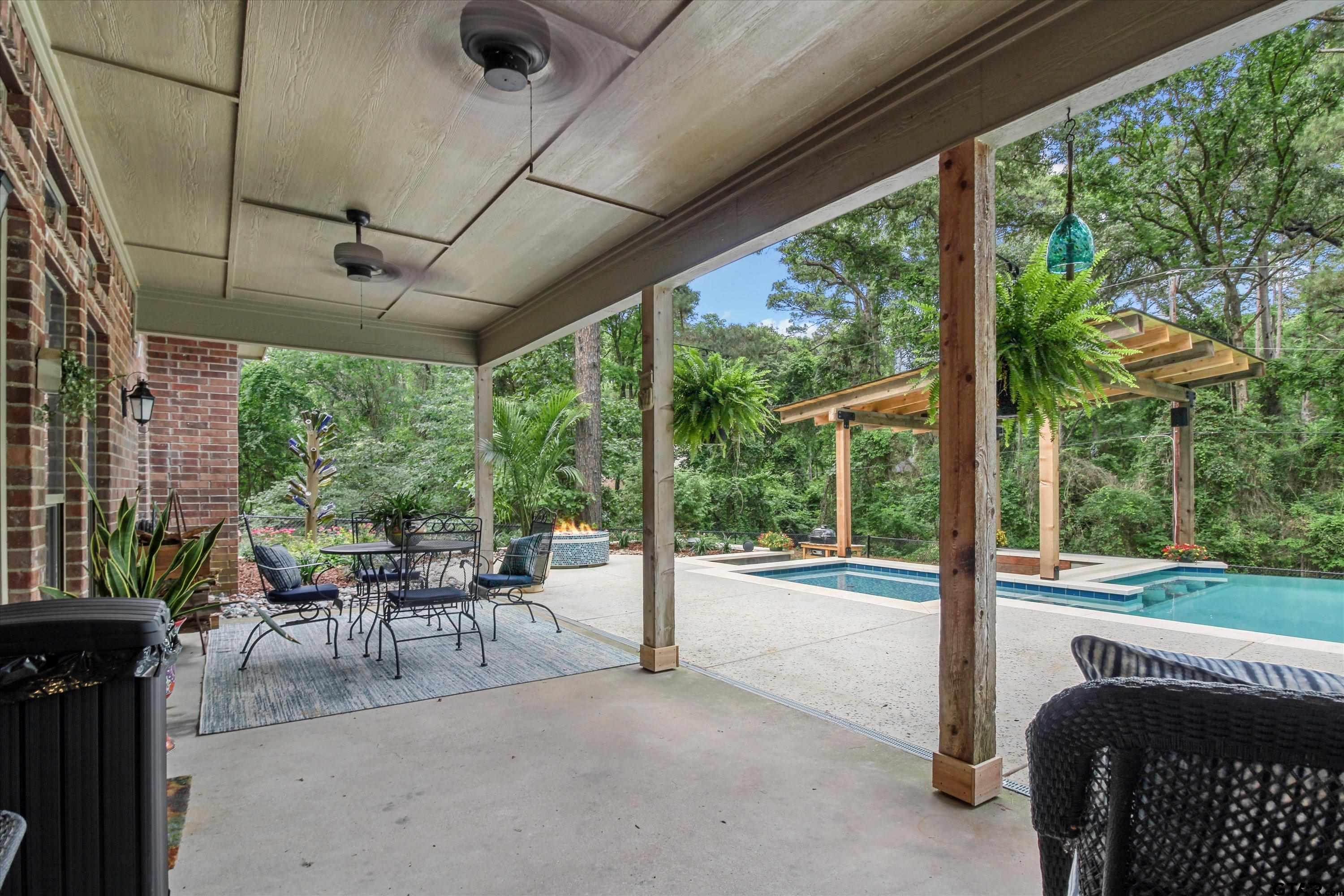 18551 Lazy Lane Flint, TX 75762 - Photo 37 of 45 a view of a porch with furniture and a yard