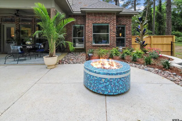 a view of a chair and fire pit in patio