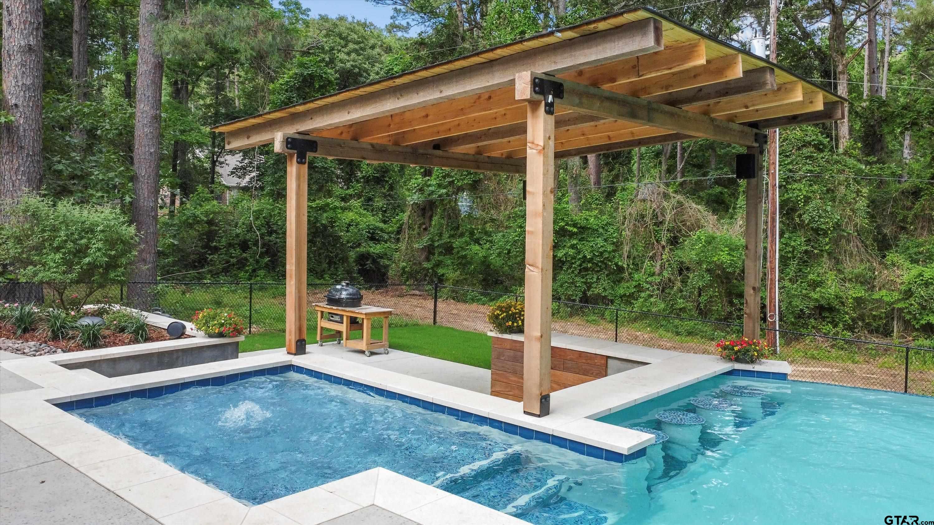 18551 Lazy Lane Flint, TX 75762 - Photo 44 of 45 a view of a patio with a table chairs and a backyard