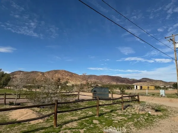 a view of a town with mountains in the background