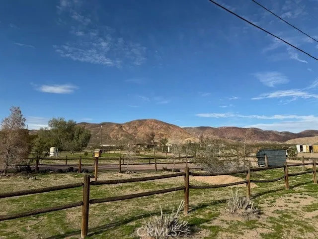 a view of residential houses with outdoor space and lake view