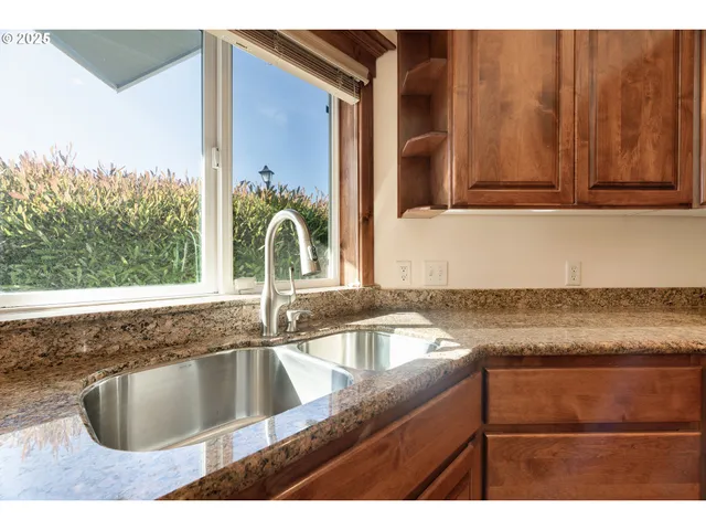 a kitchen with a sink and a window