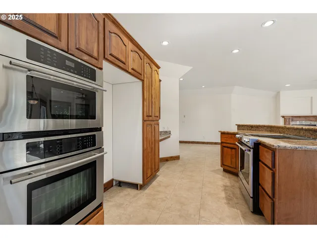 a kitchen with a stove and a microwave